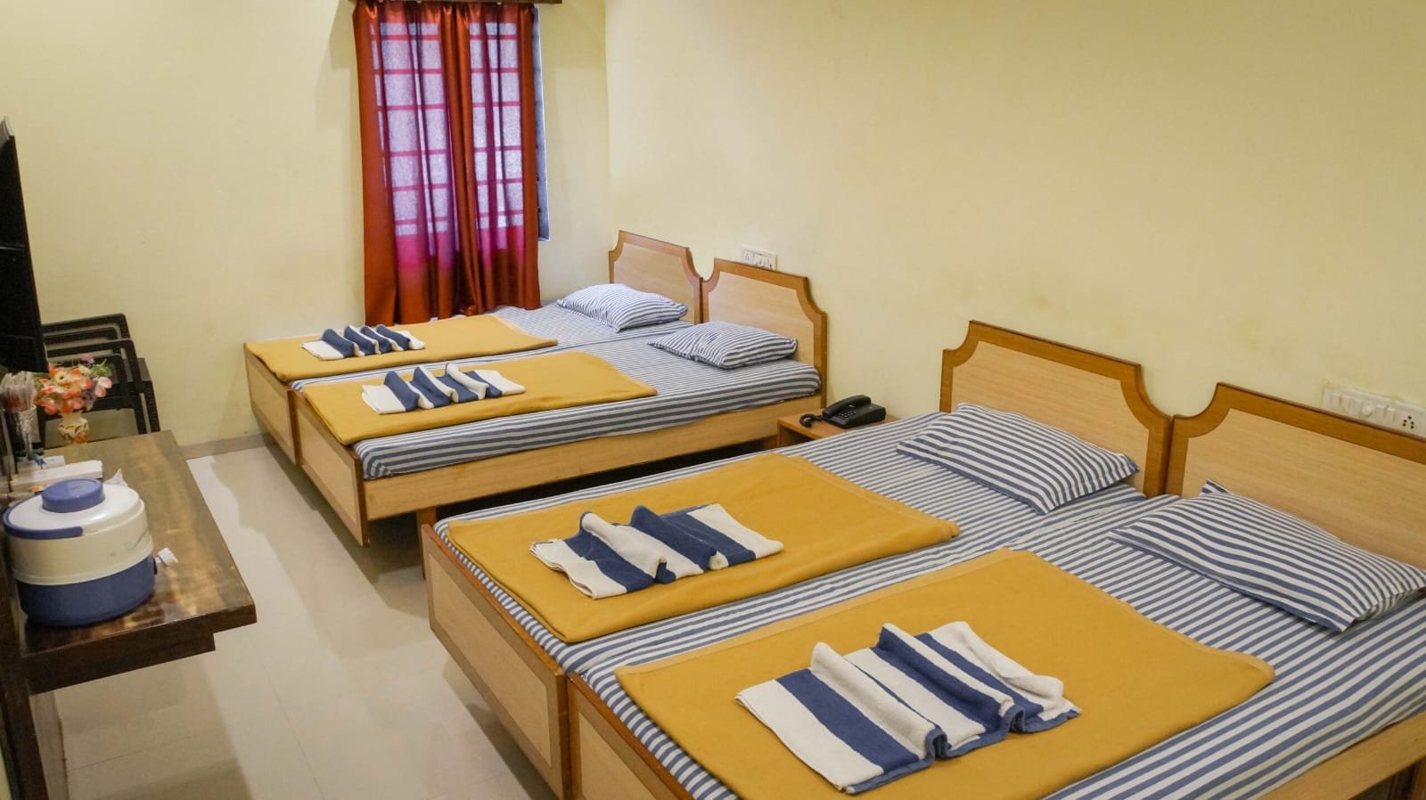 Authentic photograph of 4 Bed Room at Yadava Satram Srisailam featuring four comfortable individual beds and attached bathroom