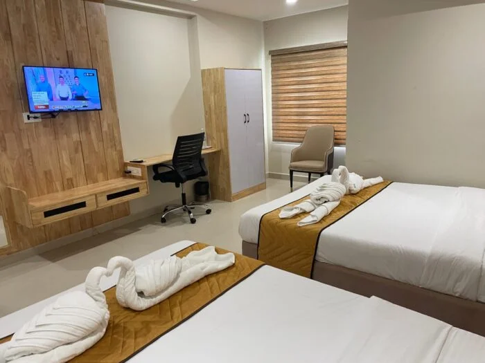 Authentic photograph of Standard Room at Yadava Satram Srisailam with clean bed and attached bathroom